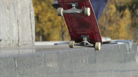 Unrecognizable Skater doing trick 5-0 grind on the street ledge on monument Stock Footage 96782486
