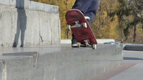 Unrecognizable Skater doing trick 5-0 grind on the street ledge on monument Stock Footage 96787165