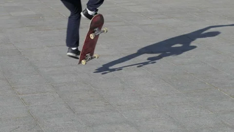 Unrecognizable Skater doing trick fs 180 on flat, close-up view in slowmotion Stock Footage 96723380