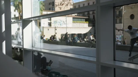 Unrecognizable skaters does different tricks in public skate park outdoors. Stock Footage 106664091