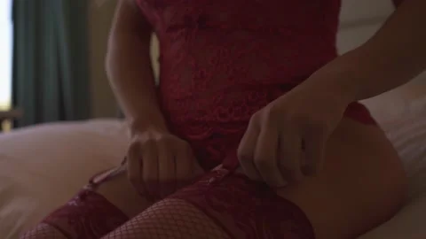 An Unrecognizable Slim Model Adjusting Her Lingerie Video stock 229820424