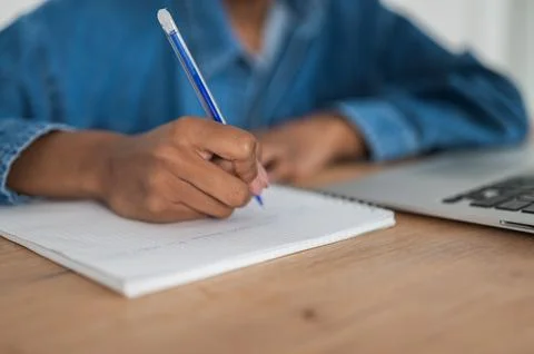 Unrecognizable Student preparing for college test, exam, writing notes, making Stock Photos