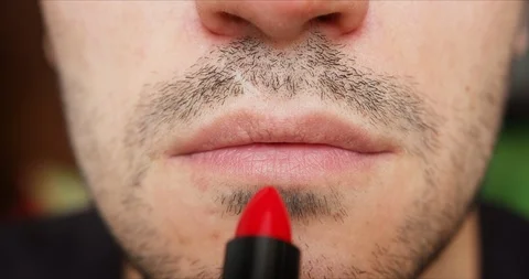 Unrecognizable transgender man rouging lips Stock Footage 126211778
