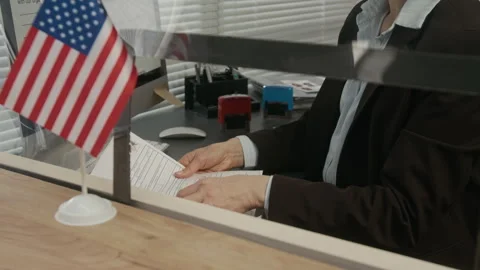 Unrecognizable USA Consular Officer Returning Rejected Visa Application Stock Footage 331517131