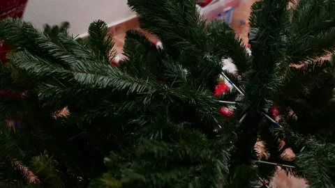 Unrecognizable woman assembling an artificial Christmas tree Stock Footage 163365324