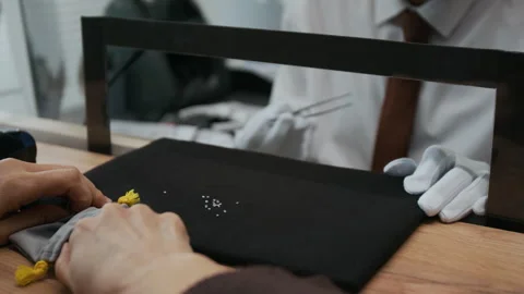 Unrecognizable Woman Bringing Tiny Gemstones for Examination in Jewelry Store Stock Footage 310134587