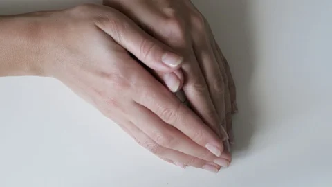 Unrecognizable woman holding an egg with a pattern in her hands. Easter eggs Stock-Footage 107933372
