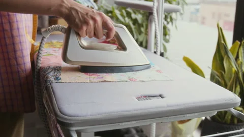 Unrecognizable Woman Ironing Patchwork Piece on Board Video stock 315773865