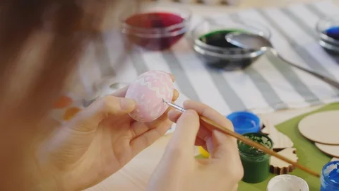 Unrecognizable Woman Painting Pattern on Easter Egg Stock Footage 124825185