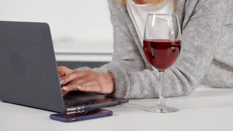 Unrecognizable woman using computer at home Stock Footage 150202800