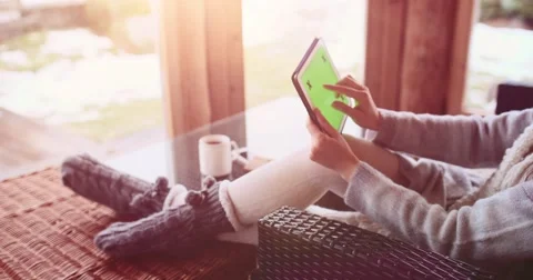 Unrecognizable woman using digital tablet with key-green screen. Slow Motion 4K 스톡 동영상 68828174