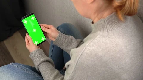 Unrecognizable woman using green screen chroma key smartphone Stock Footage 237159248