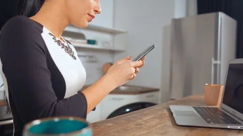 Unrecognizable woman using her smartphone Stock Footage 107387237