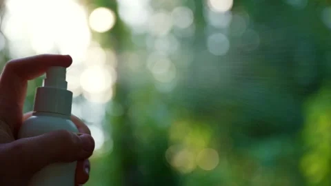 Unrecognizable woman using insect sprays disease prevention. Protection against Stock Footage 310602659