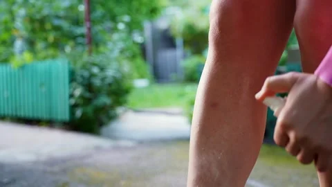 Unrecognizable woman using insect sprays disease prevention. Protection against Stock Footage 310604042