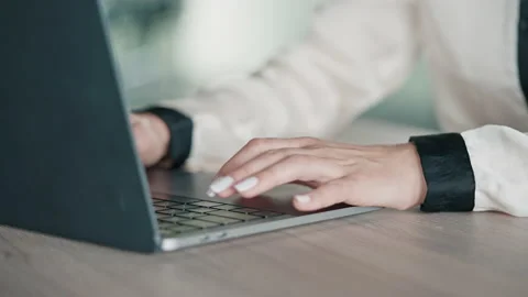 Unrecognizable woman working with computer and diagrams Stock Footage 164893039