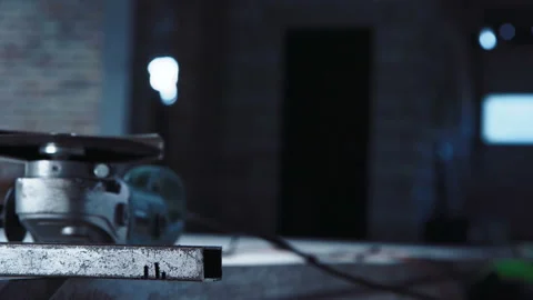 Unrecognizable worker cutting with angle grinder Stock Footage 100560178
