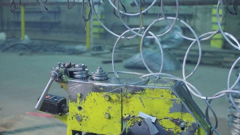 Unrecognizable worker producing metal net in the factory Stock-Footage 97851758