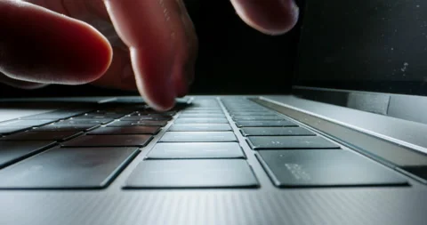 Unrecognizable worker using laptop computer, actively typing on keyboard. Close Video stock 132737340