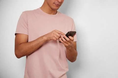Unrecognizable young man with happiness by using his smart phone Stock Photos