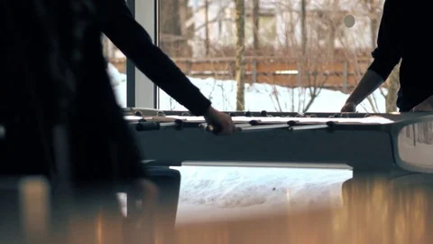 Unrecognizable young men playing table football game. 4K shot Stock Footage 73072245