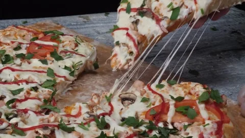 Unrecognizable young people taking pizza slices in slow motion from Vidéo 336586632