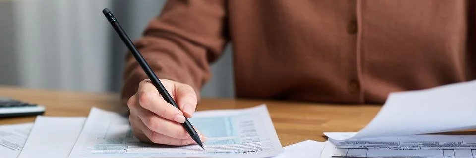 Unrecognizable Young Woman Checking Data in Documents Header Stock Photos