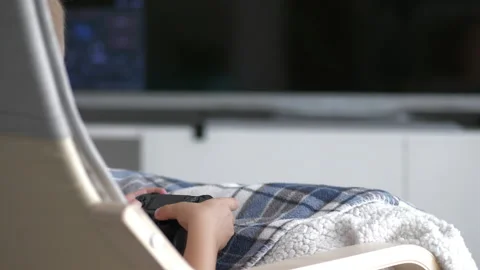 Unrecognized caucasian boy holding console game controller and pressing Stock Footage 211342145