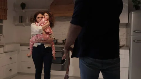 Unrecognized, dangerous man terrorizing his wife and daughter Stock Footage 234746208