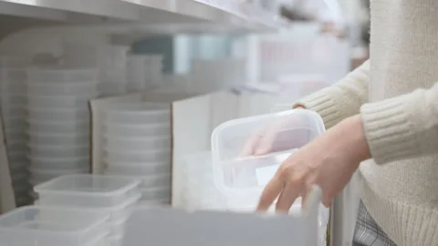 Unrecognized female choosing dishes tableware in retail store Stock Footage 155080038