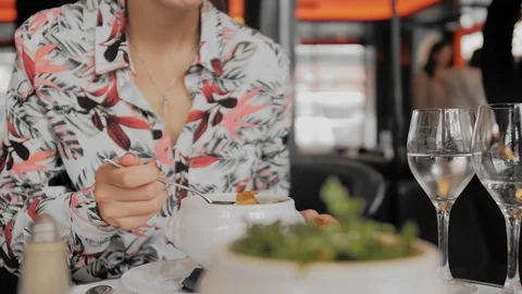 Unrecognized female tourist eats in a Paris restaurant. Close-up, Slow Motion Stock Footage 114771379