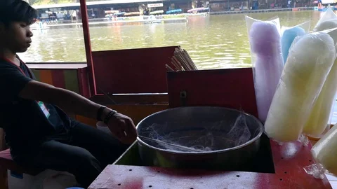 Unrecognized man making a spun sugar. Stock Footage 95171018