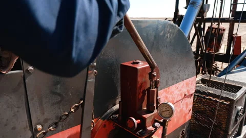 Unrecognized man operating drilling equipment.  Stock Footage 278736641