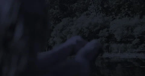 Unrecognized model puts her hands up in the air, moves her fingers,night scene Stock Footage 138109900