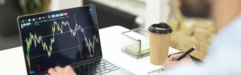 Unrecognized office worker checking the statistics in computer Stock Photos
