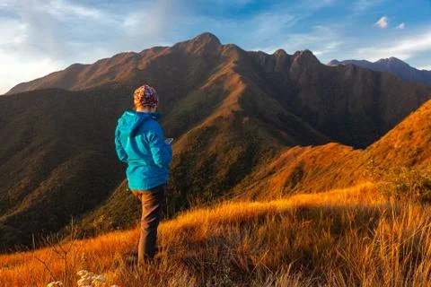 Unrecognized people using a celular smartphone in a mountain landscape Stock Photos