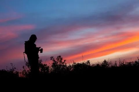 Unrecognized people using a celular smartphone in a mountain landscape Stock Photos
