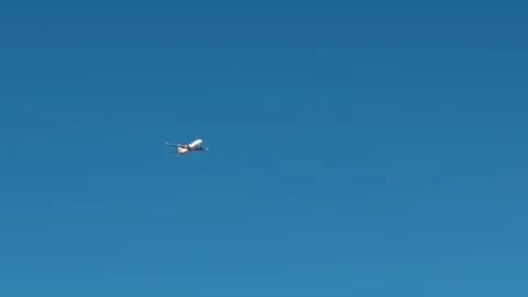 Unrecognized plane flies high in the sky. The concept of unfulfilled dreams Video stock 119763194