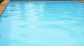 Unrippled Blue Water in Swimming Pool. HD Footage