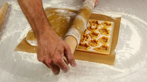 Unroll dough on cutting sheet. Making Christmas Gingerbread Cookies. Stock Footage 77225327