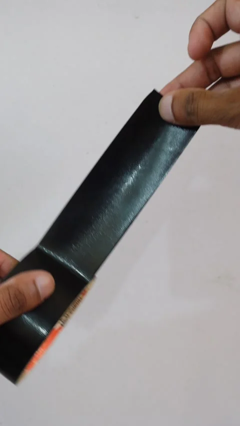 Unrolling Adhesive Tape And Cutting It With Scissors, First Person POV Video stock 346281653