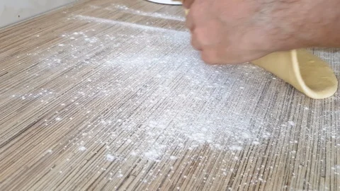 Unrolling dough with rolling pin Stock Footage 126325823