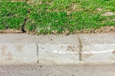 Unrolling grass, applying turf rolls on new lawn Stock Photos
