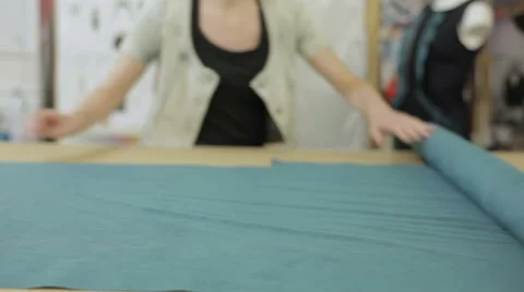 Unrolling a roll of fabric Stock Footage 51430274