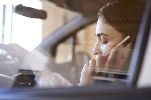 Unsafe driving. Talking on the Phone While Driving Stock Photos