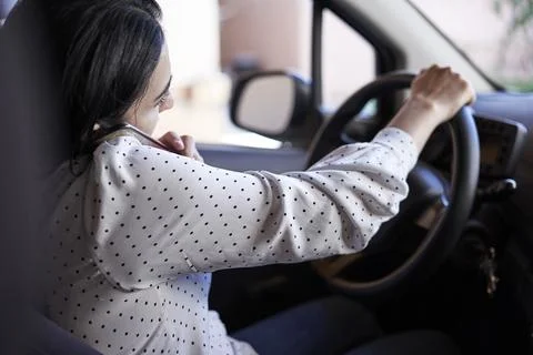 Unsafe driving. Talking on the Phone While Driving Stock Photos
