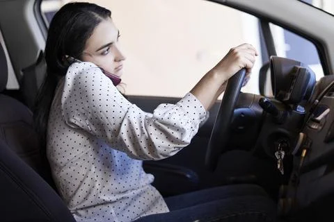 Unsafe driving. Talking on the Phone While Driving Stock Photos