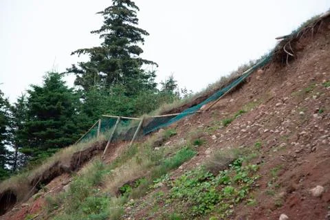 Unsafe fence eroding Foto stock