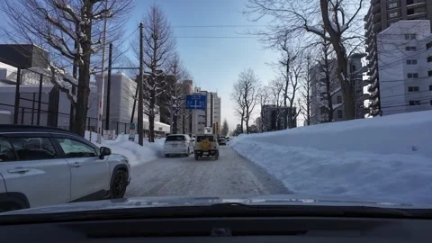 Unsafe lane change causing braking reaction winter traffic Sapporo Video stock 333229652