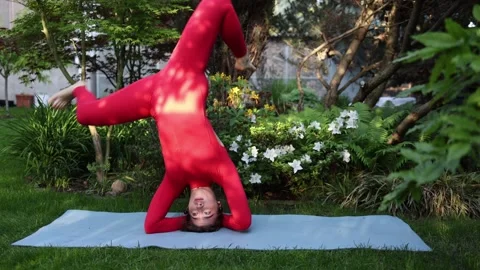 Unsafe self taught headstand practice Stock-Footage 336780666